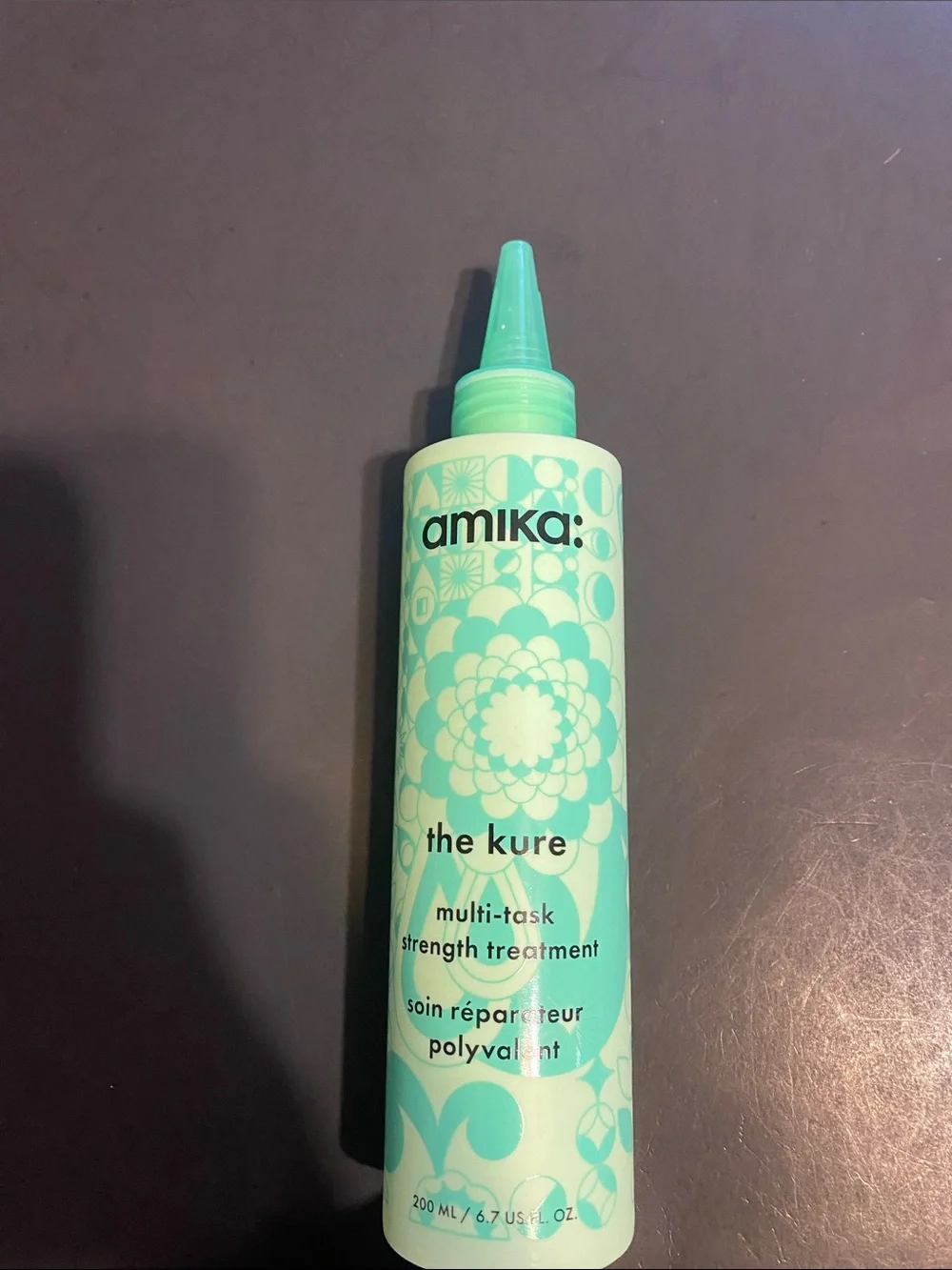 Anika: the Kure hair treatment bottle